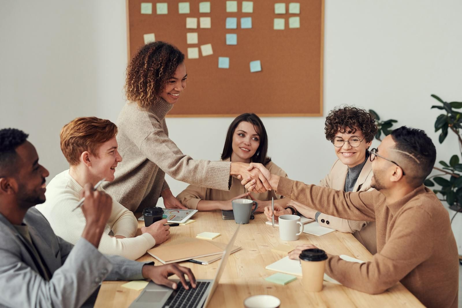 Business meeting handshake — hiring a janitorial company