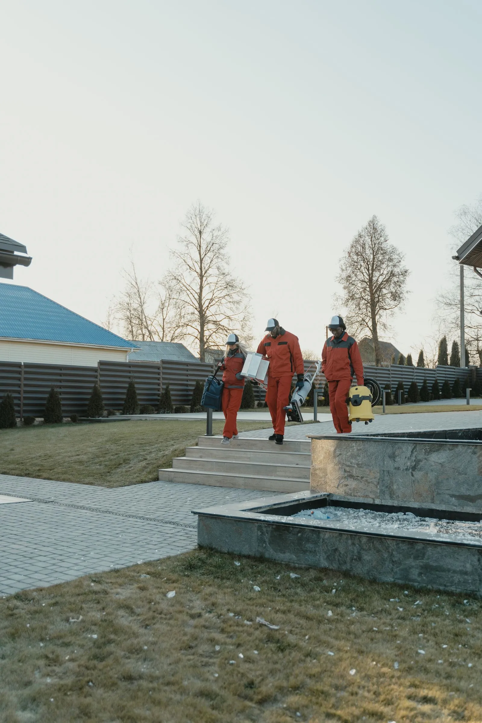 Commercial cleaning crew arriving at a property with professional equipment
