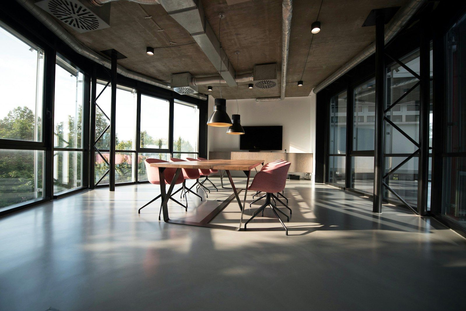 Spotless glass-walled conference room in a commercial office