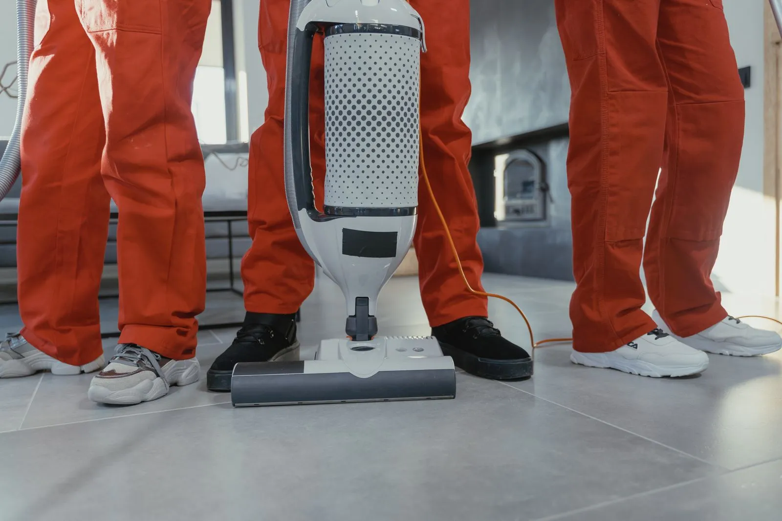 Commercial upright vacuum working across carpeted flooring