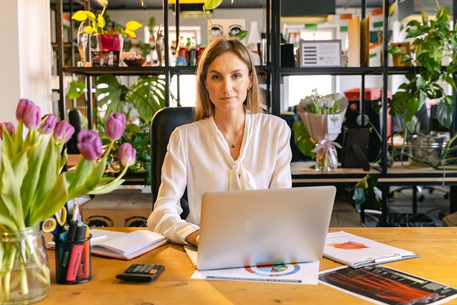 Facility manager planning cleaning frequency at an office desk