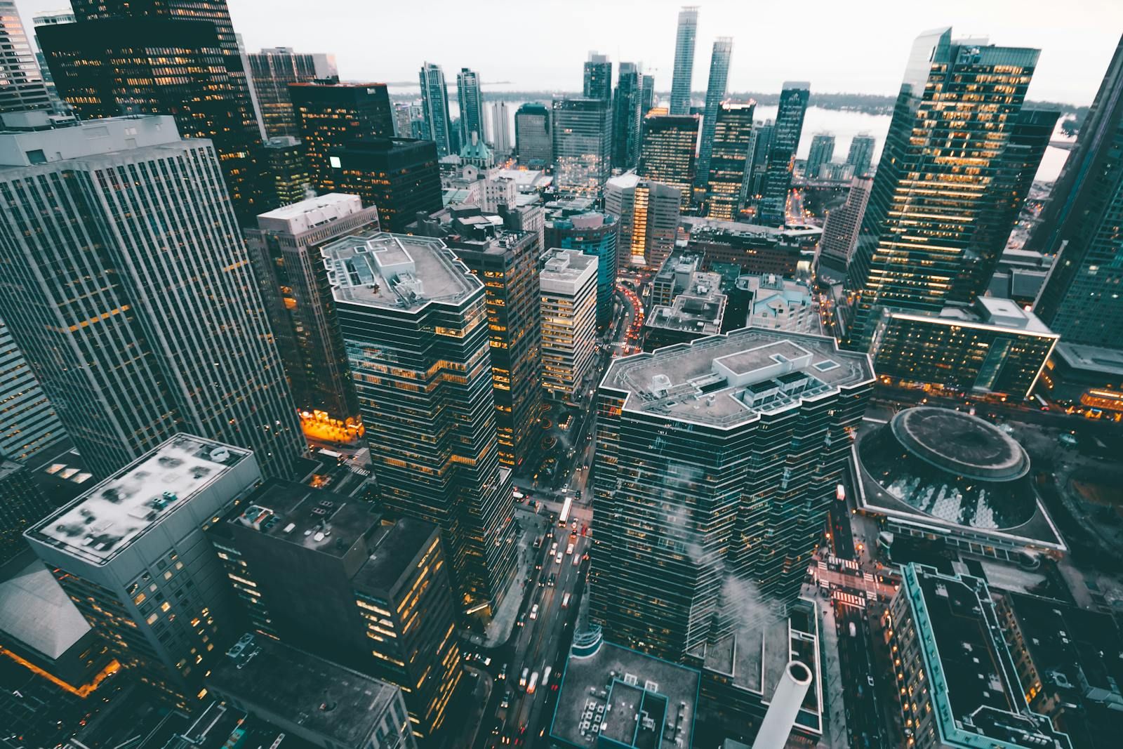 Aerial view of dense downtown office towers at dusk