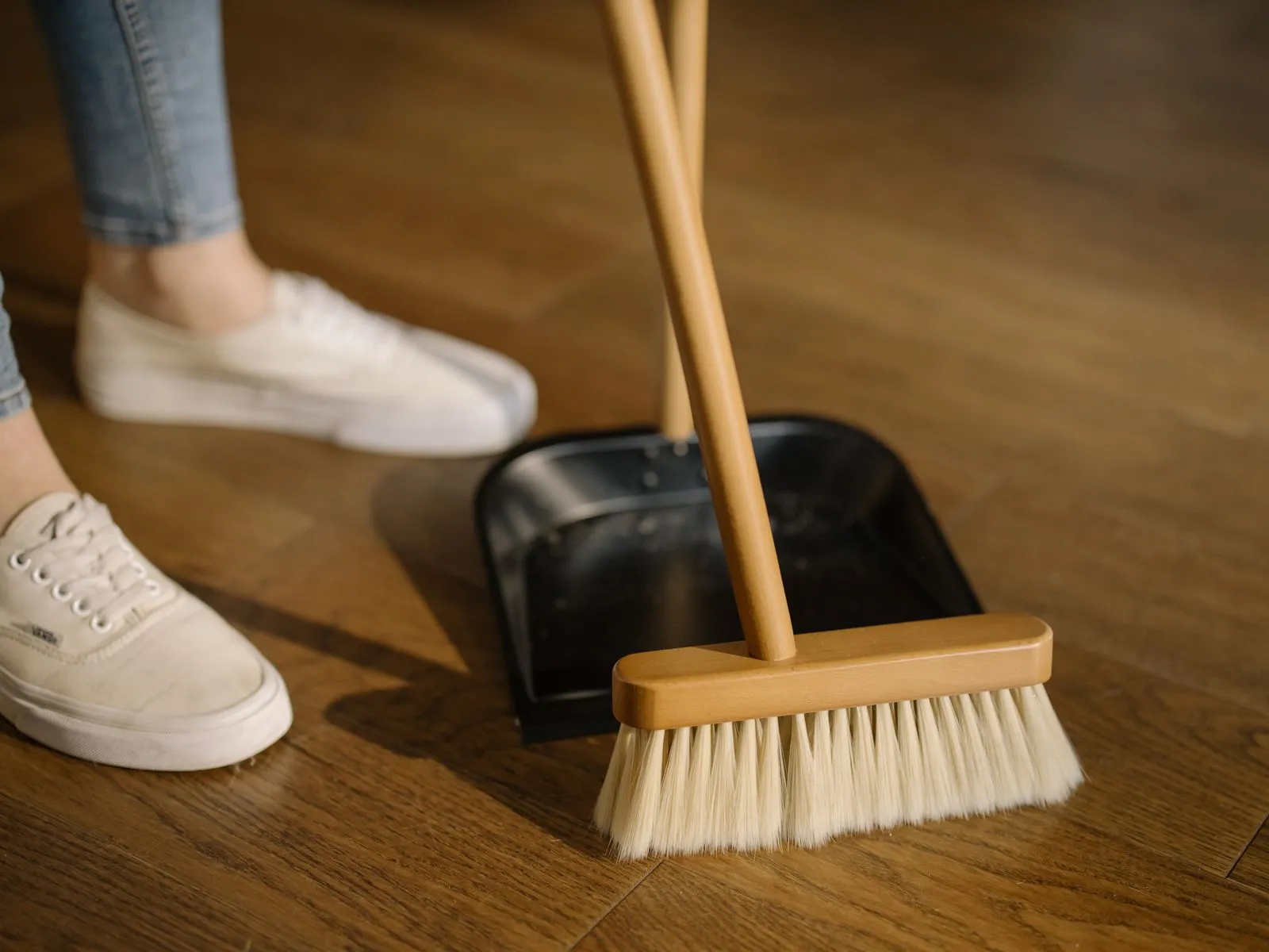 Sweeping a hardwood floor in a Washington DC home