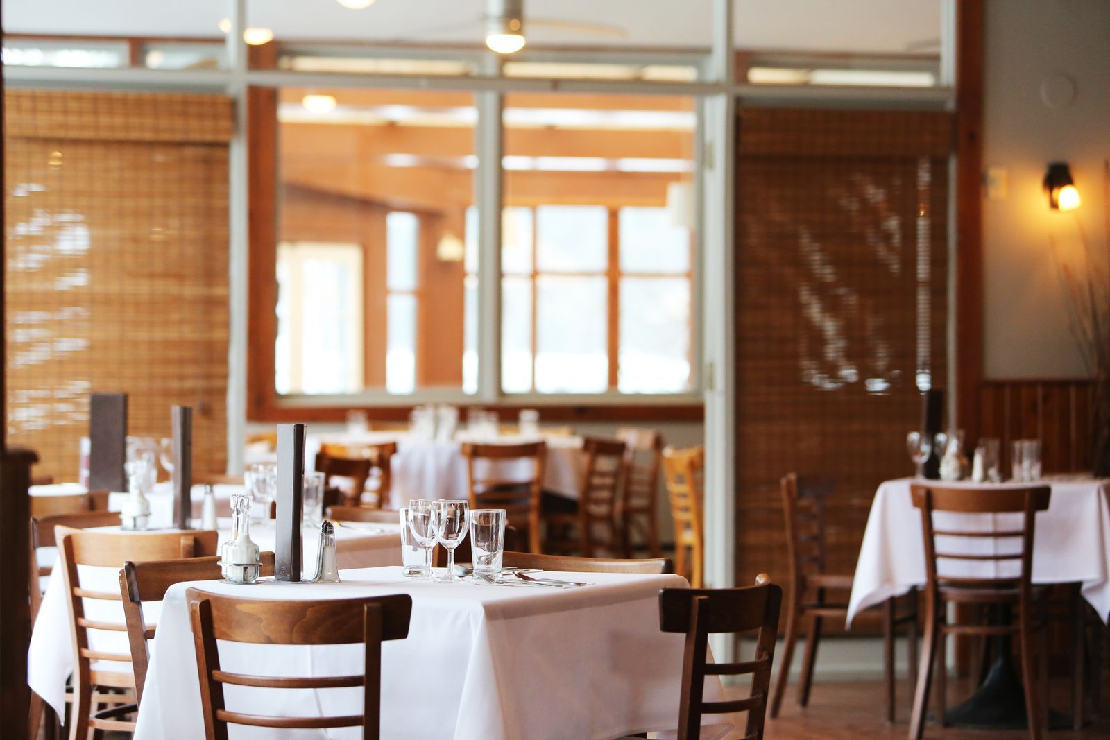 Bright restaurant dining room with set tables