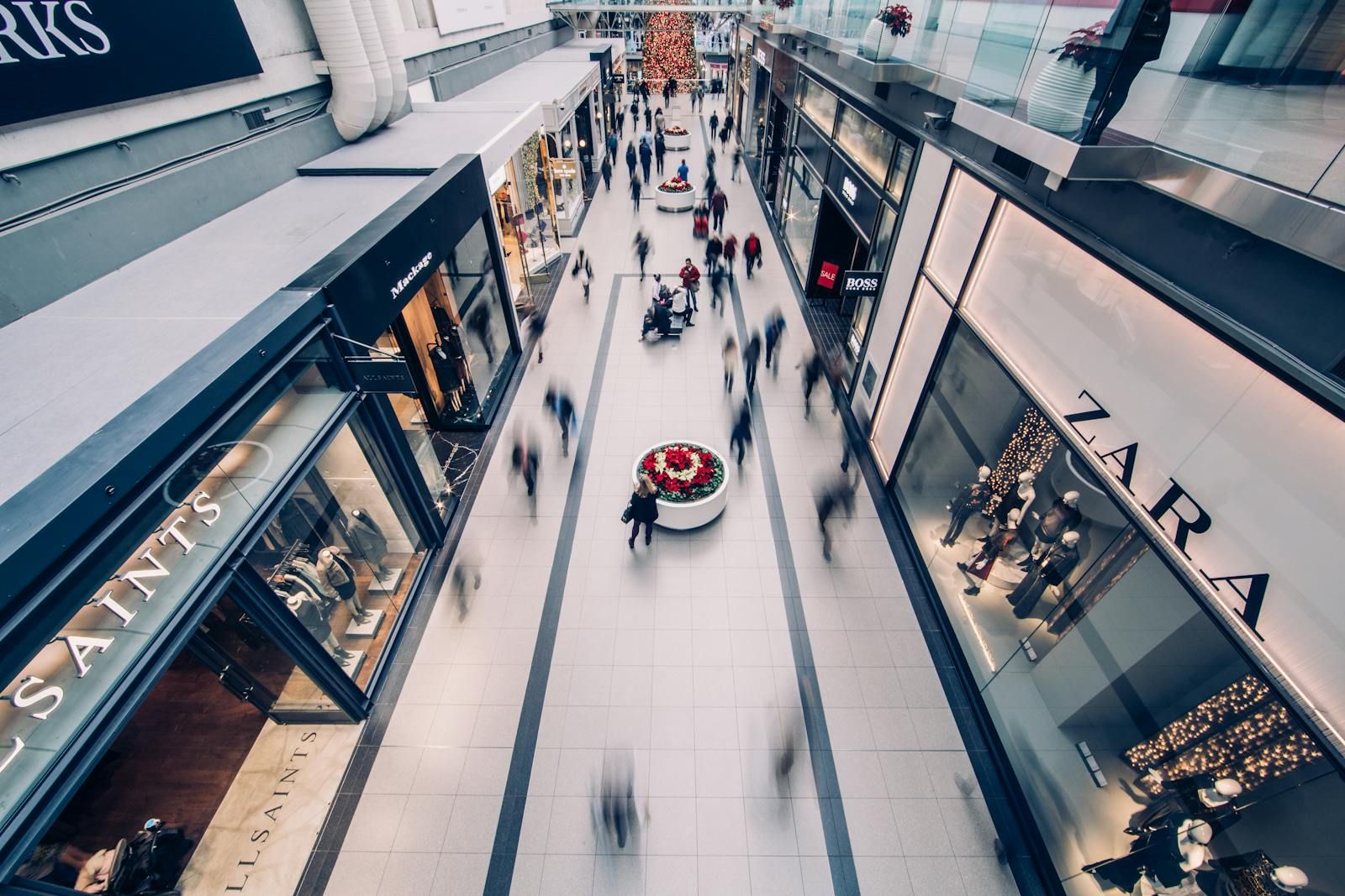 Busy multi-level retail shopping concourse