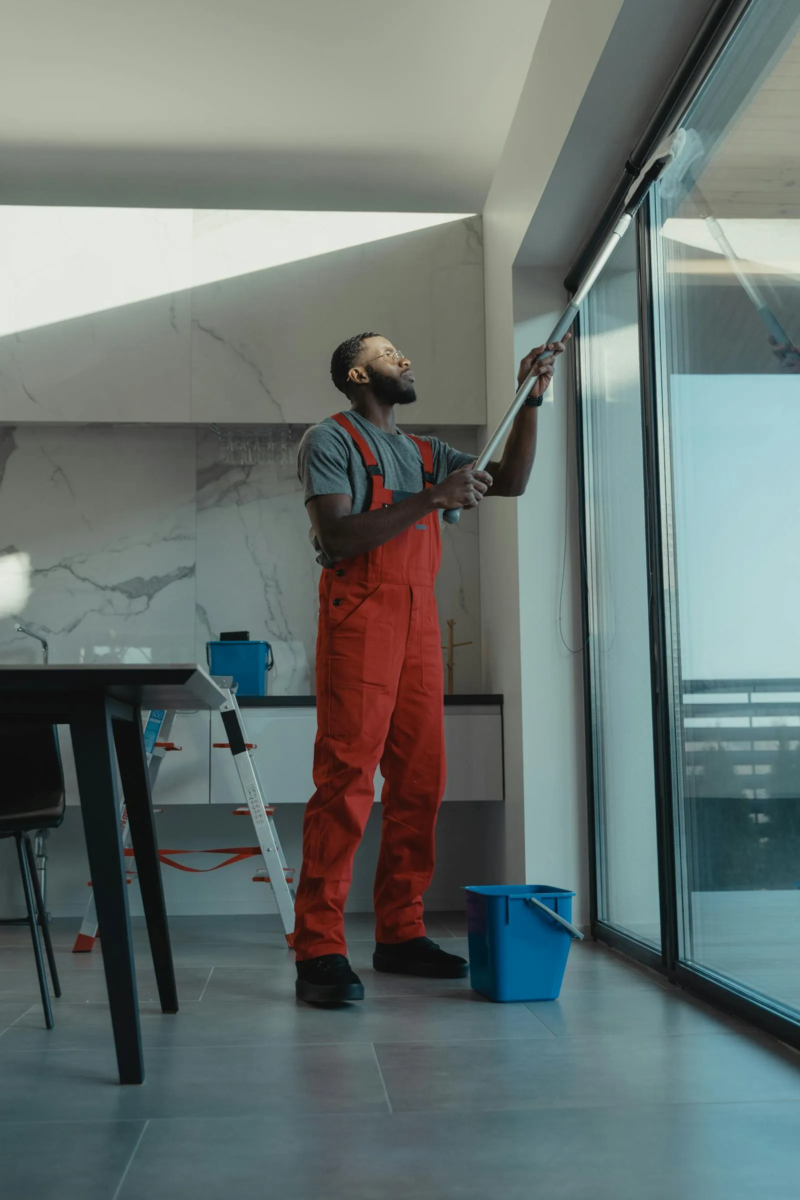 Professional squeegee cleaning of floor-to-ceiling commercial windows